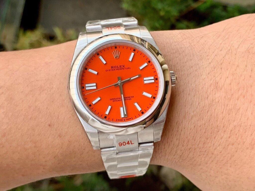 ĐỒNG HỒ ROLEX OYSTER PERPETUAL CƠ NAM DÂY KIM LOẠI MẶT MÀU ĐỎ EW FACTORY REP 1:1 CAO CẤP 41MM